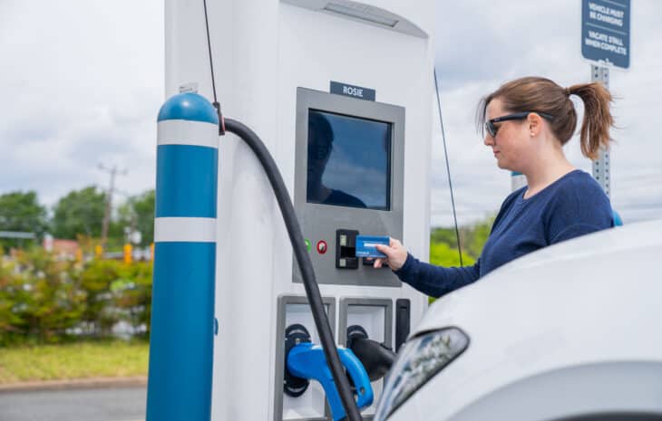 Woman using DC Fast Charger 